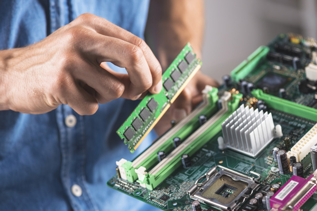 close-up-engineer-putting-ram-memory-module-computer-motherboard_23-2147883863