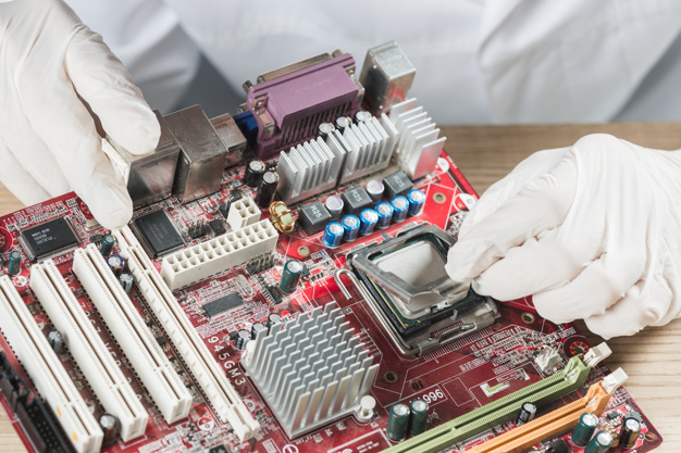 elevated-view-technician-working-computer-motherboard_23-2147923525