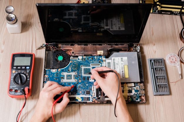 hands-contemporary-technical-repairman-using-two-small-soldering-irons-repair-broken-laptop_274679-4661